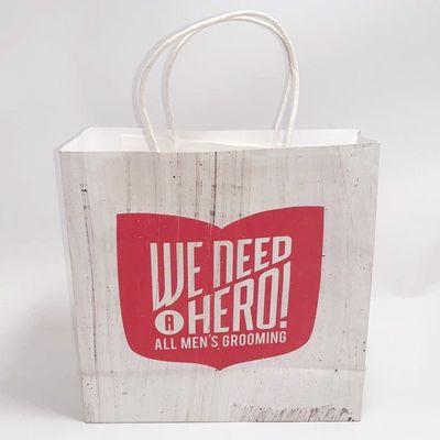 Bon prix Le cadeau blanc de papier de Papier d'emballage imprimé par coutume de papier d'emballage de sacs d'épicerie met en sac pliable en ligne